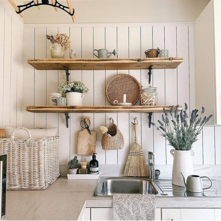Rustic kitchen with shiplap wall panelling and scaffold shelves with brackets