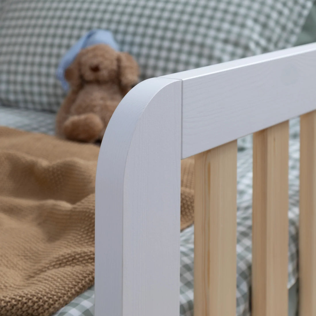 Should I choose a natural wood or white finish for a toddler bed?