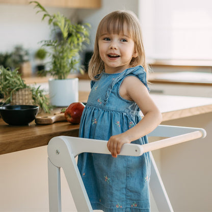 Side view of Roomix foldable toddler learning tower highlighting compact fold feature for easy storage