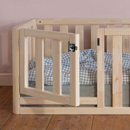 High sided toddler floor bed showcasing protective side panels and minimalist design, perfect for early childhood rooms