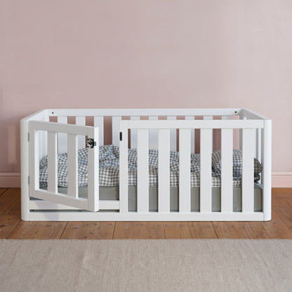 Close-up of Roomix toddler bed’s high sides and smooth wooden finish, highlighting child-safe rounded corners