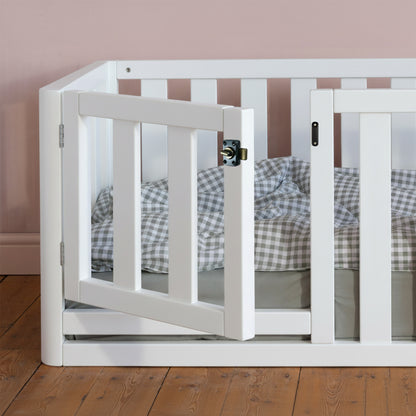 Roomix high sided toddler floor bed styled in a bright room, emphasizing secure sides and low height for easy access